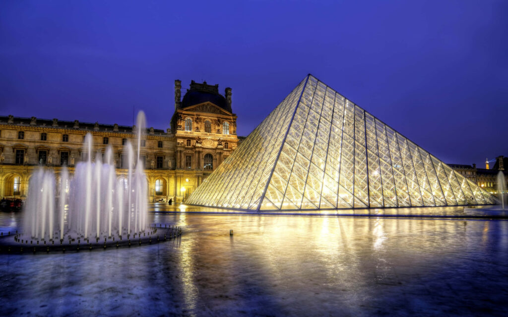 Breathtaking Louvre Museum Night View with Illuminated Pyramid Wallpaper