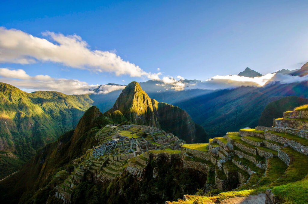 Breathtaking Machu Picchu Wallpaper: Ancient Incan Ruins & Blue Sky