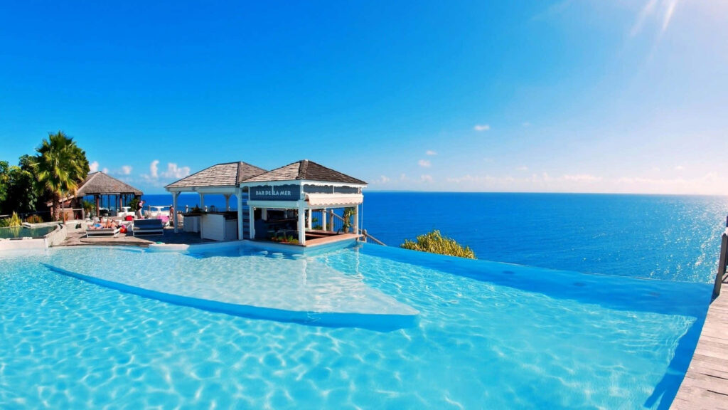 Idyllic Maldives Beach Escape: Infinity Pool & Tropical Paradise Background Wallpaper