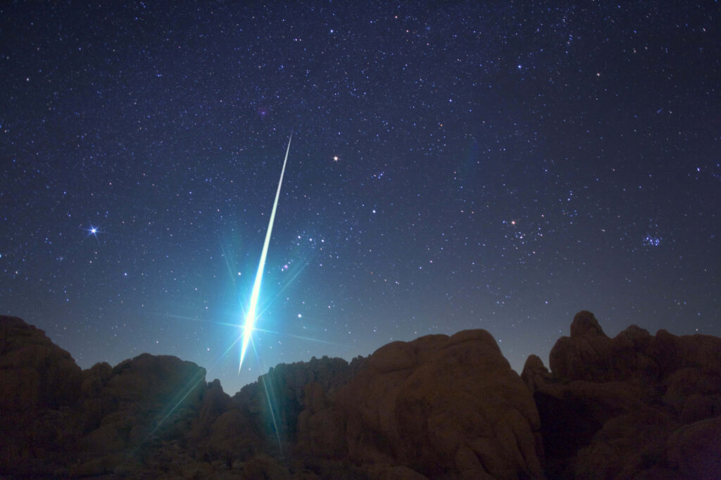 Stunning Meteor Illuminates Starry Night Sky - Rocky Landscape Wallpaper
