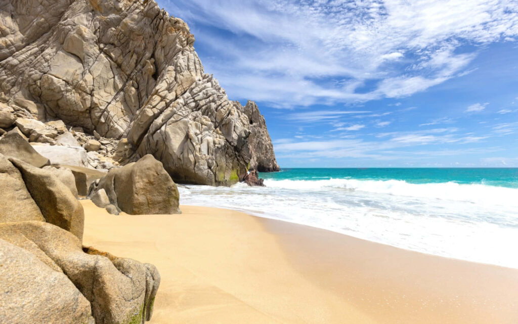 Serene Mexican Beach: Golden Sands & Turquoise Waters Under Blue Sky Wallpaper