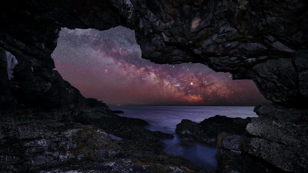 Stunning Milky Way Wallpaper: Serene Cave View & Vibrant Night Sky