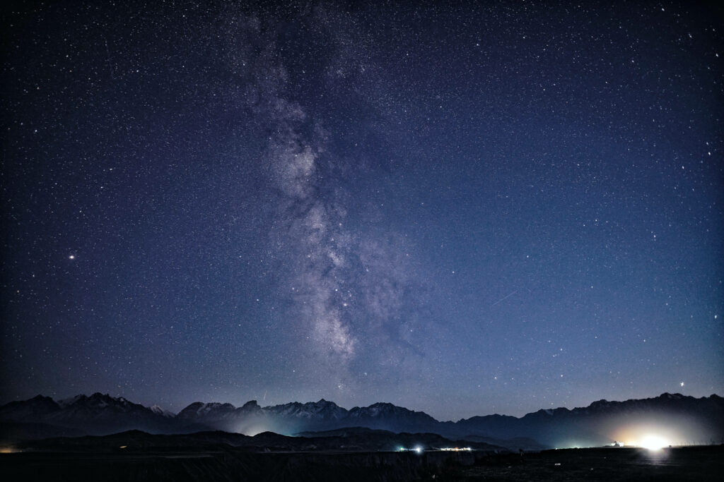 Stunning Milky Way Wallpaper: Rugged Peaks Under Starry Sky