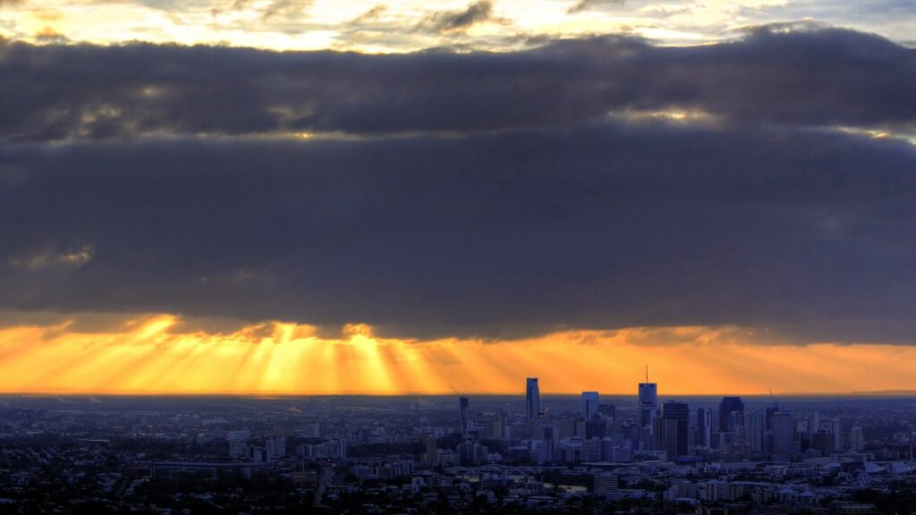Breathtaking City Skyline Wallpaper at Sunrise with Golden Light