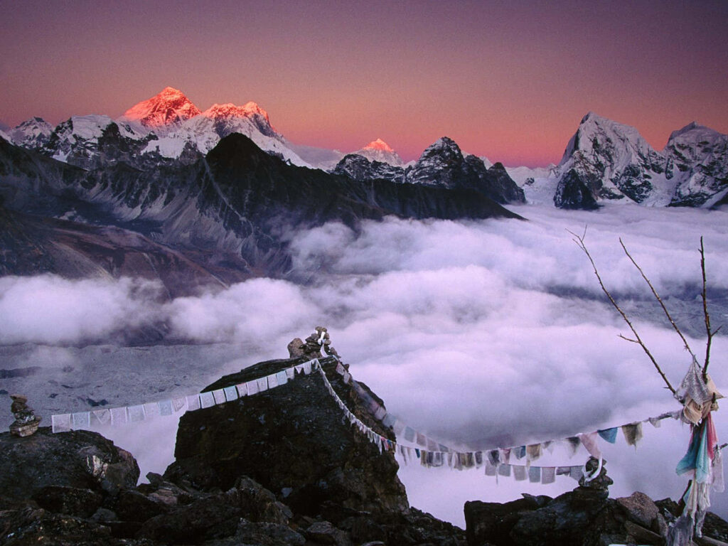 Stunning Mount Everest Sunrise Wallpaper with Prayer Flags & Clouds