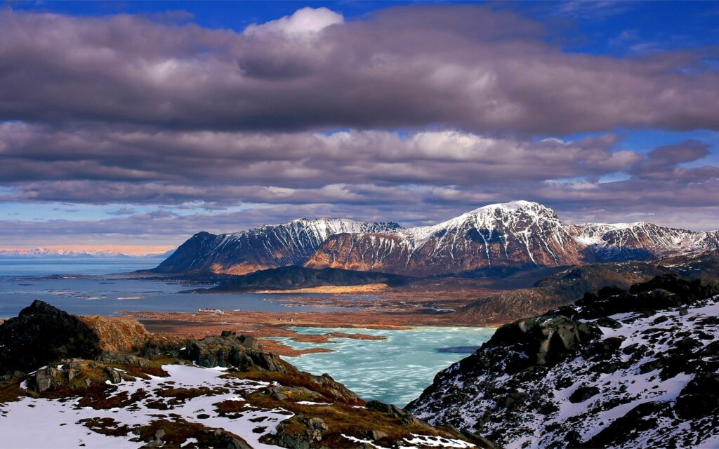 Breathtaking HD Mountain Range Wallpaper with Dramatic Sky