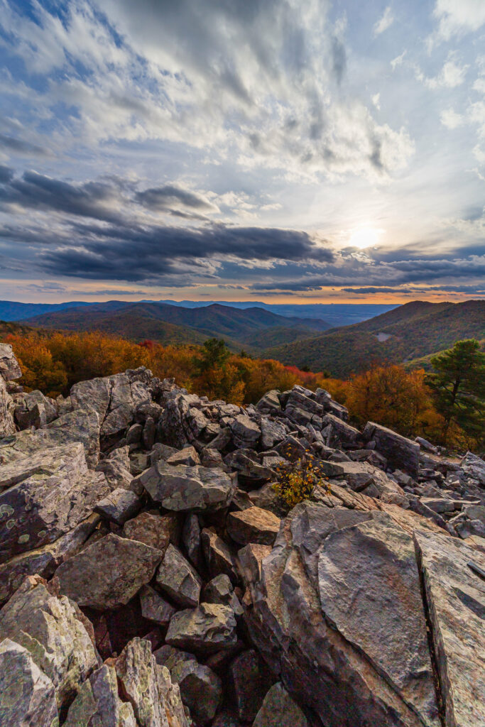 Breathtaking mountain sunset with rugged rocks autumn trees and dramatic colorful sky wallpaper