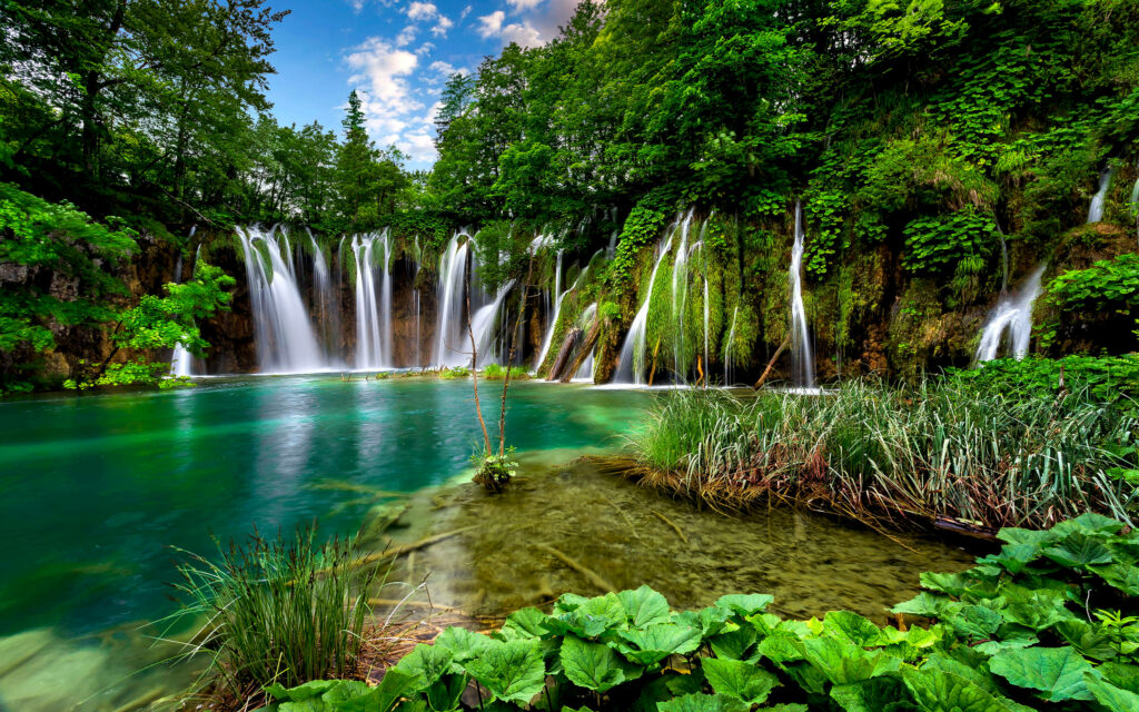 Serene Desktop Wallpaper: Lush Landscape & Cascading Waterfalls