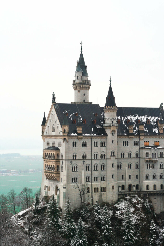 Snowy Neuschwanstein Castle: Stunning Winter Landscape Wallpaper