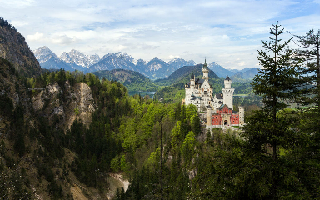 Neuschwanstein Castle Wallpaper: Majestic Mountains & Lush Forests