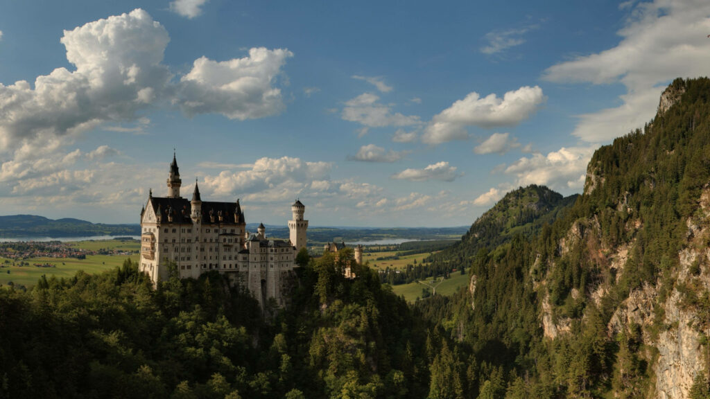 Breathtaking Neuschwanstein Castle Wallpaper: Cliffs & Green Forests
