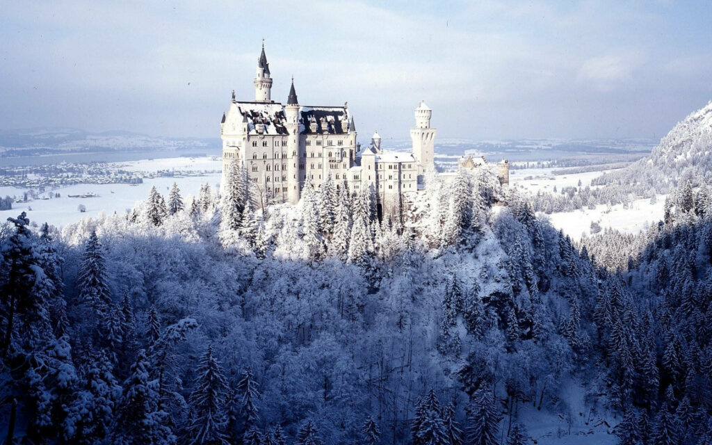 Neuschwanstein Castle: Stunning Snowy Landscape Wallpaper Background