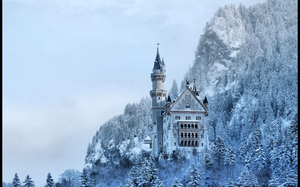 Breathtaking Winter Wallpaper: Neuschwanstein Castle in Snowy Serenity