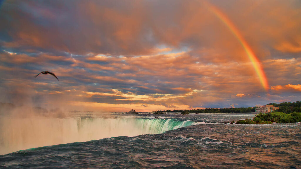 Breathtaking Niagara Falls Sunset Wallpaper with Rainbow Background