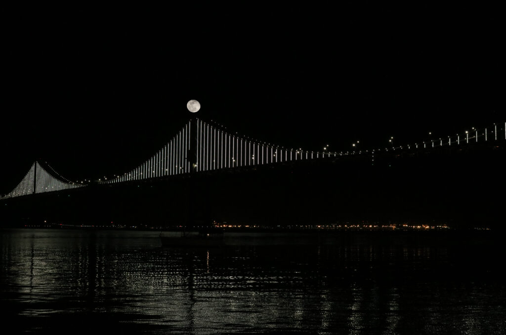 Serene Bridge Night View with Moonlit Reflection - Wallpaper Background