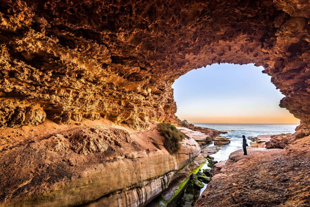 Stunning Ocean Views from a Breathtaking Cave Chamber Wallpaper