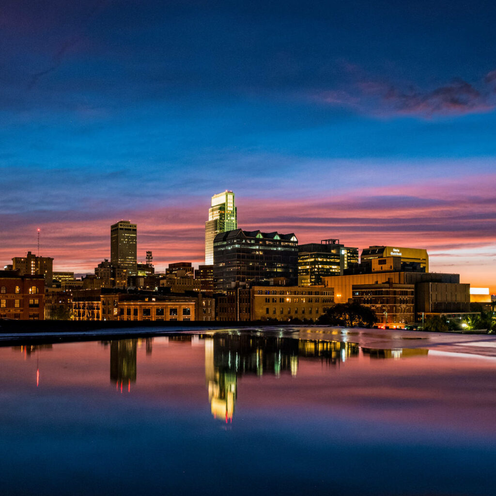 Breathtaking Omaha Skyline Sunset Wallpaper with Vibrant Reflection
