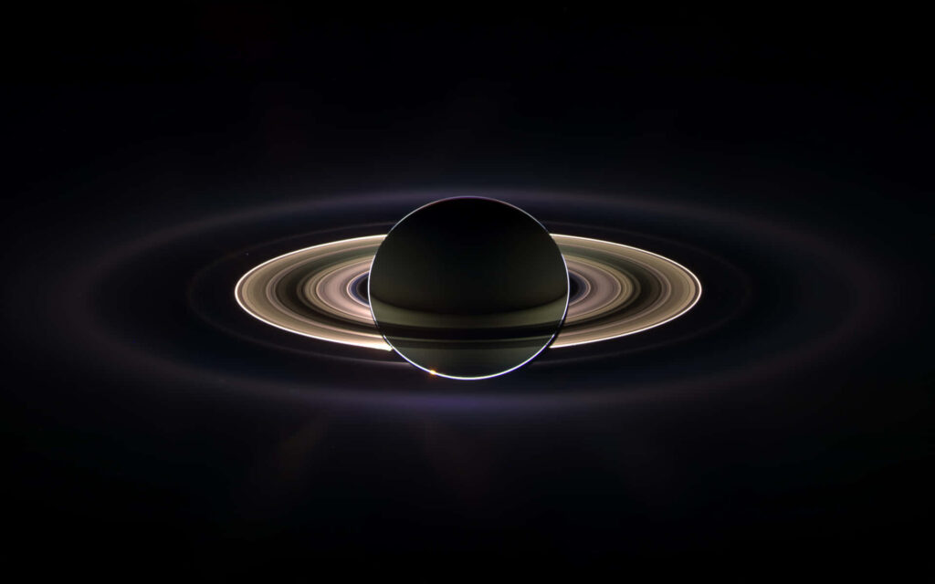 Stunning Saturn Wallpaper: Illuminated Rings in Outer Space