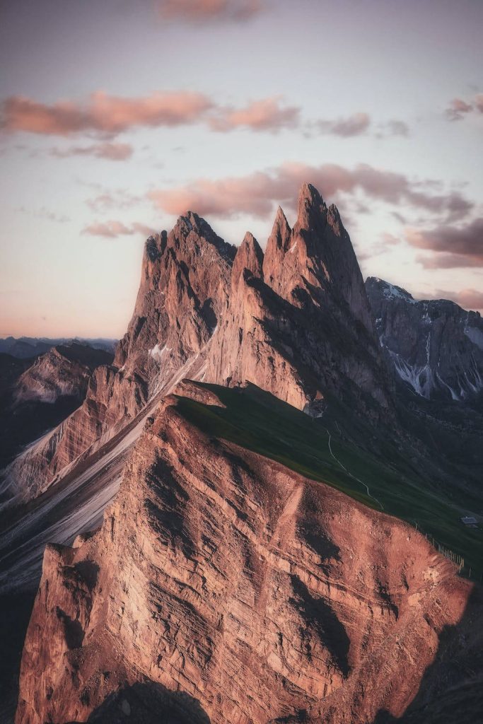 Sunset view of Seceda ridgeline Dolomites jagged peaks majestic mountain iPhone wallpaper background