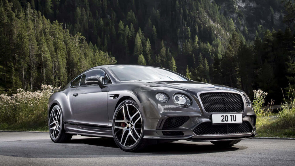 Exceptional Elegance: 2018 Bentley Continental GT Shines Amidst Majestic Mountain Backdrop Wallpaper