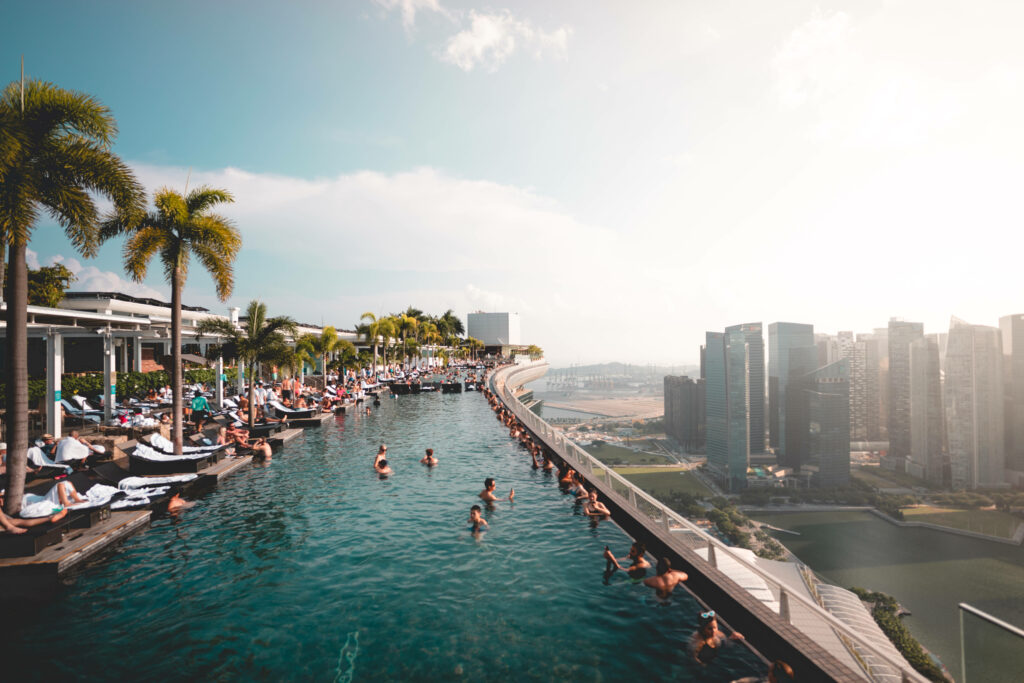 Breathtaking Singapore Skyline View from Rooftop Infinity Pool Wallpaper