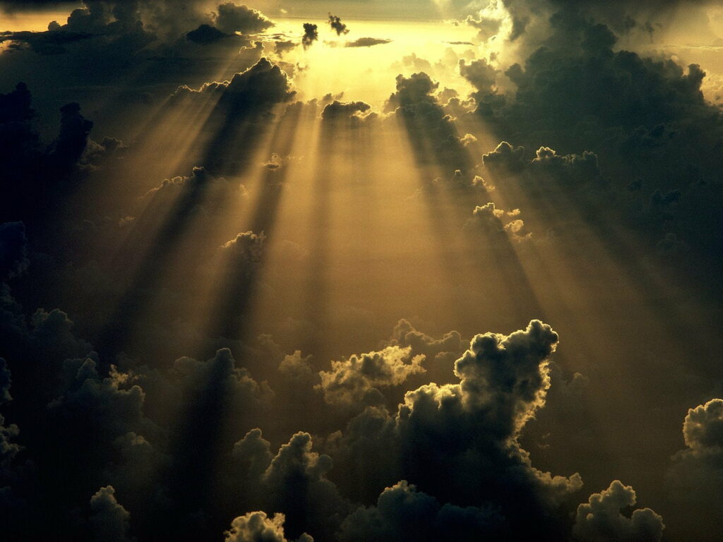 Heavenly Sky Wallpaper: Dramatic Clouds and Sun Rays Background