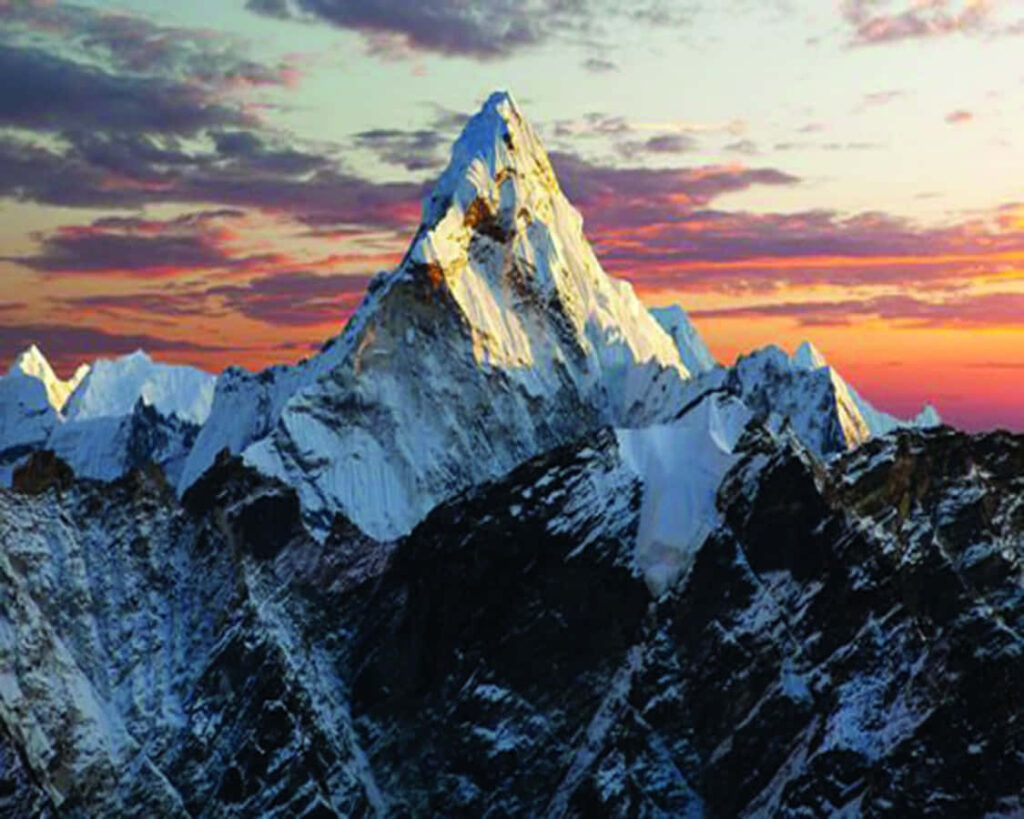 Stunning Sunset Over Snow-Capped Mountain Peak Wallpaper Background