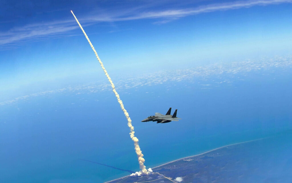 Breathtaking Space Shuttle Launch Wallpaper with Fighter Jet & Sky