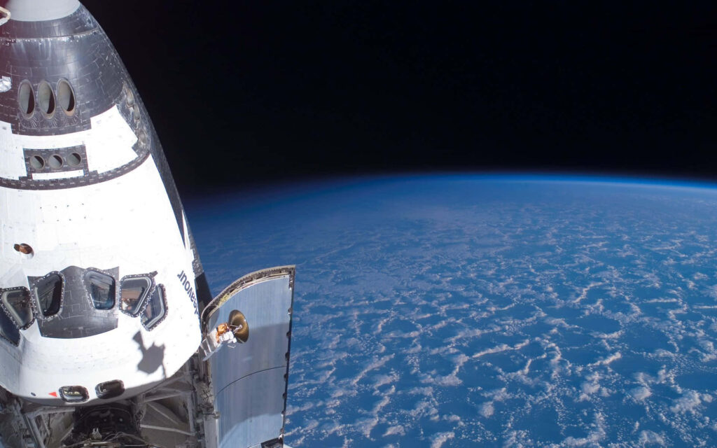 Breathtaking Space Shuttle Orbiting Earth - Wallpaper Background