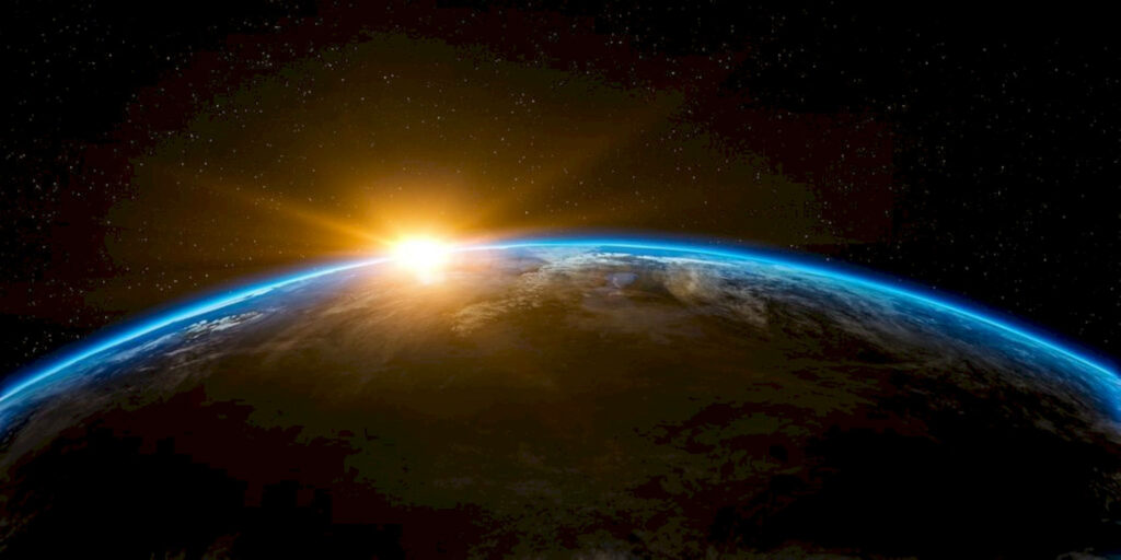 Breathtaking Sunrise from Space Wallpaper - Cosmic Beauty Background