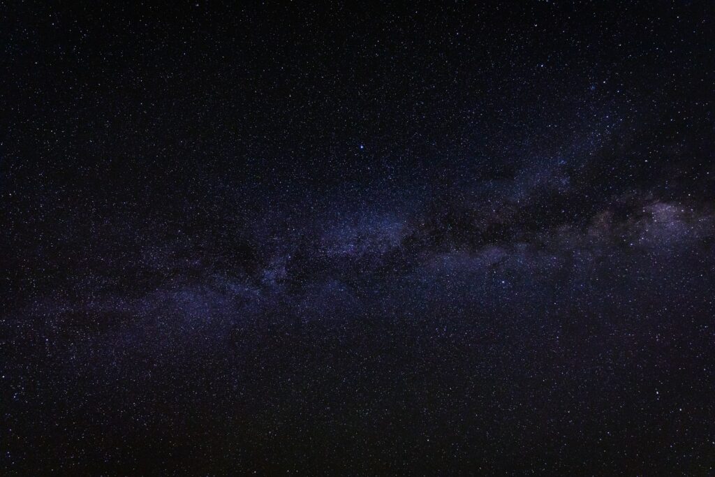 Breathtaking Starry Sky Wallpaper with Ethereal Nebula Background