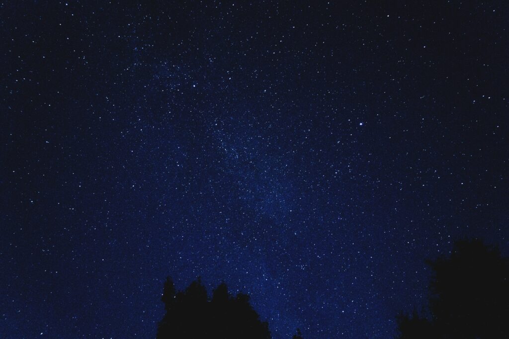 Breathtaking Starry Sky Wallpaper: Tranquil Blue Night Serenity