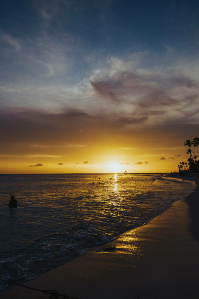 Tropical Sunset Beach Wallpaper: Serene Yellow Hues & Palm Silhouettes