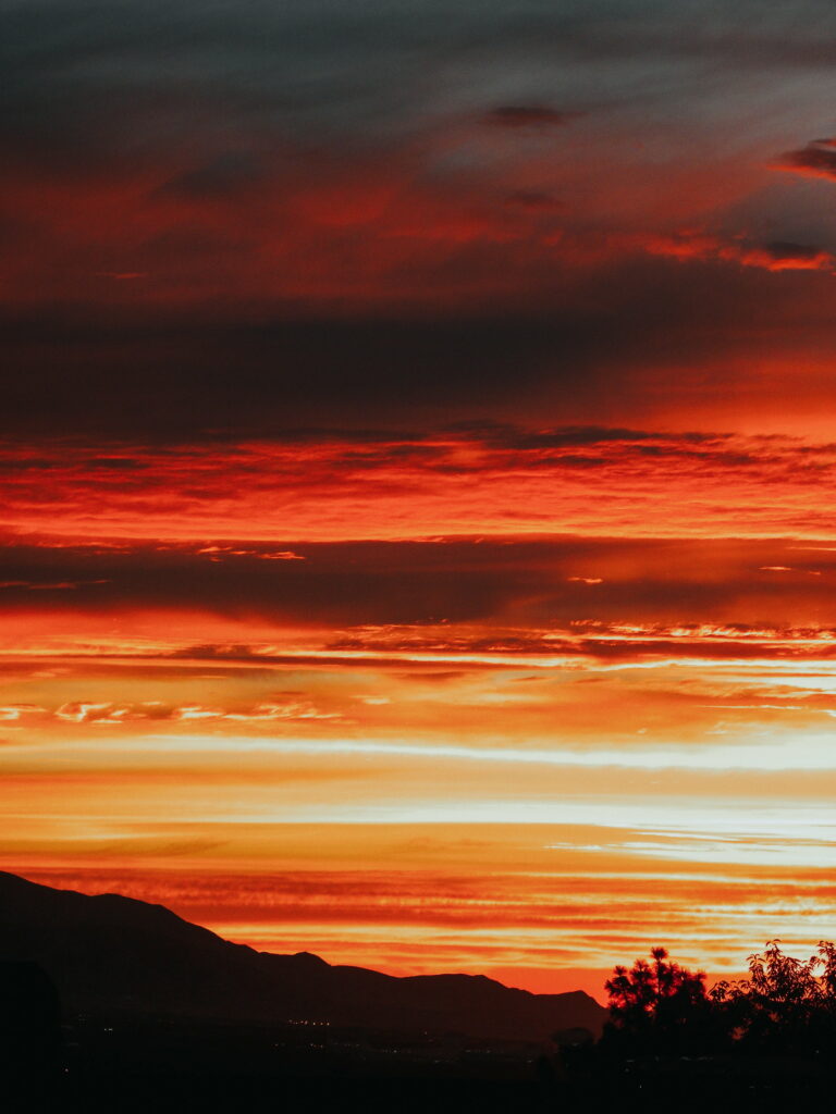 Breathtaking Sunset HD Phone Wallpaper: Vibrant Sky & Dramatic Clouds