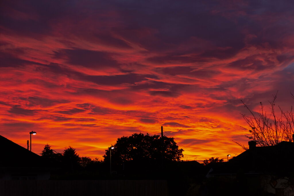 Stunning Sunset HD Wallpaper: Fiery Sky & Dramatic Clouds Background
