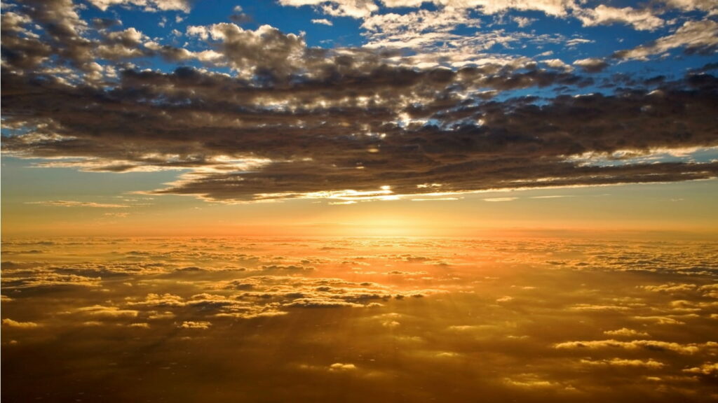 Breathtaking Sunset HD Wallpaper Above Fluffy Clouds