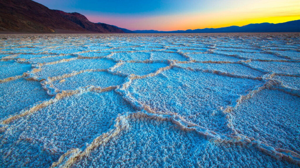 Stunning Sunset Wallpaper Over Badwater Basin: Vibrant Natural Landscape