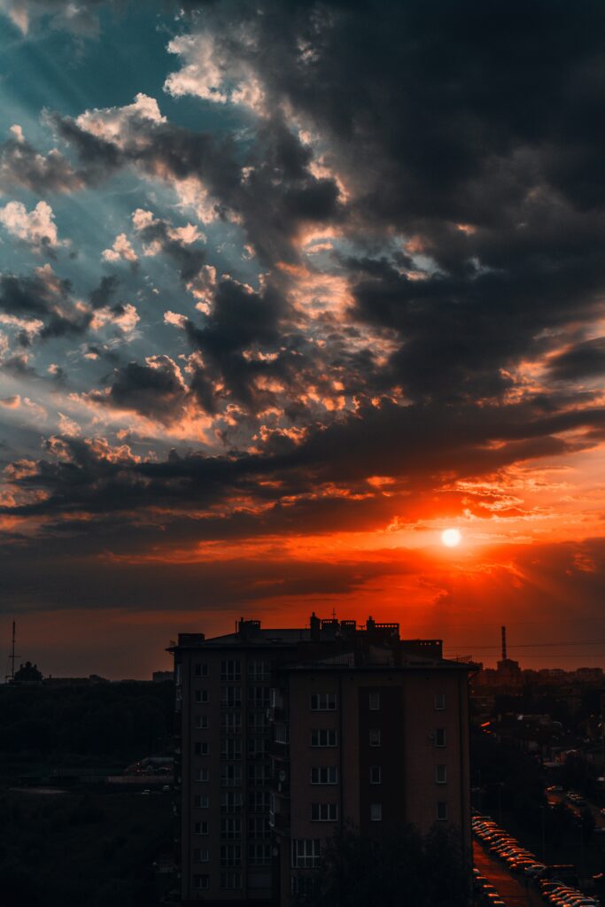 Stunning Sunset Wallpaper: Building Silhouette Against Vibrant Sky