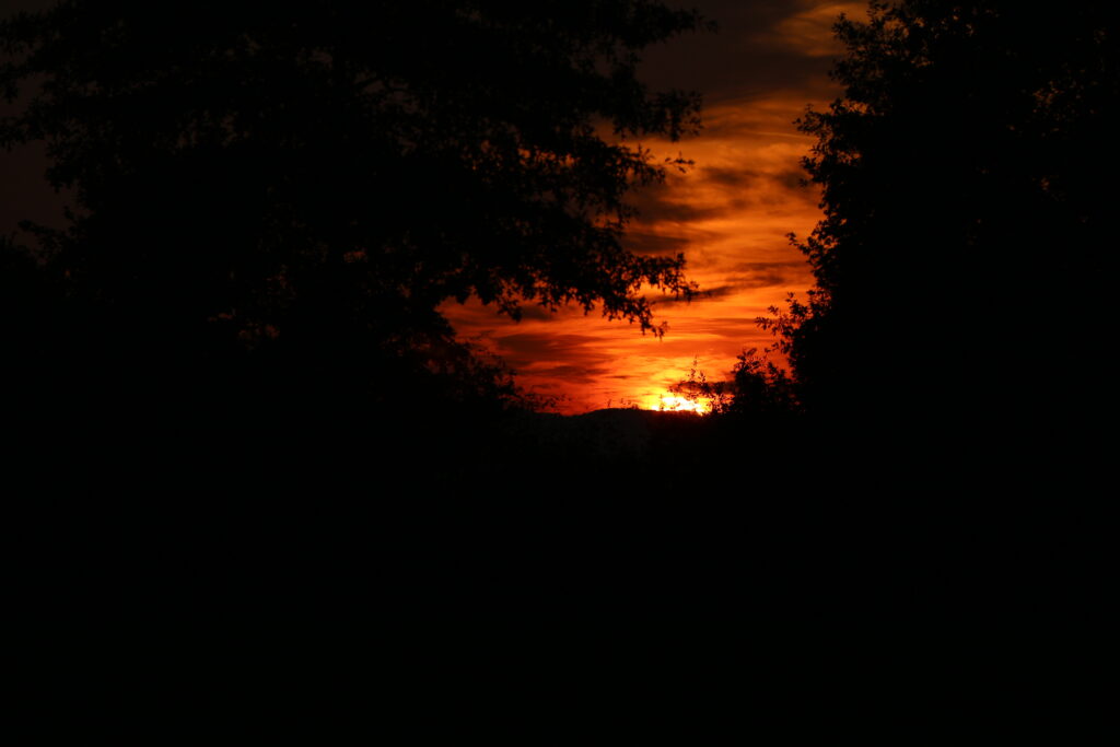 Breathtaking Sunset Wallpaper: Fiery Orange and Red Sky Background