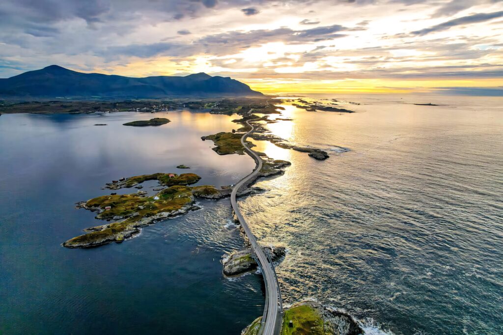 Breathtaking Aerial View of Storseisundet Bridge - Sunset Wallpaper