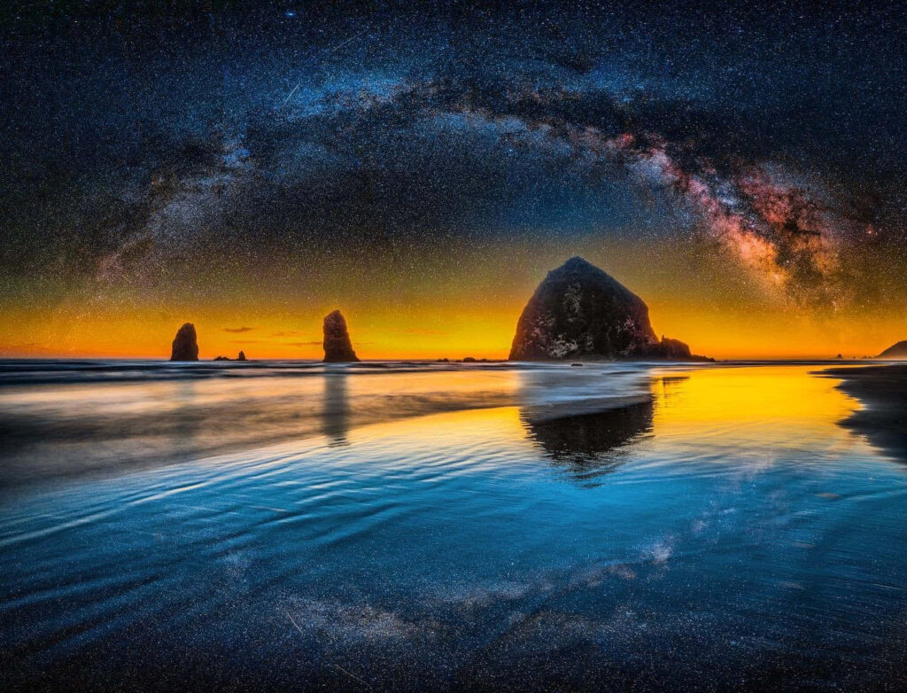 Stunning Haystack Rock Sunset with Milky Way Over Oregon Coast Wallpaper