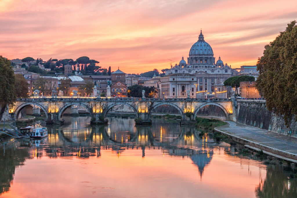 Breathtaking Tiber River View with St. Peter's Basilica at Sunset Wallpaper