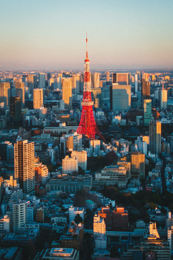 Stunning Tokyo Tower View: Warm Sunlit Skyline Wallpaper Background