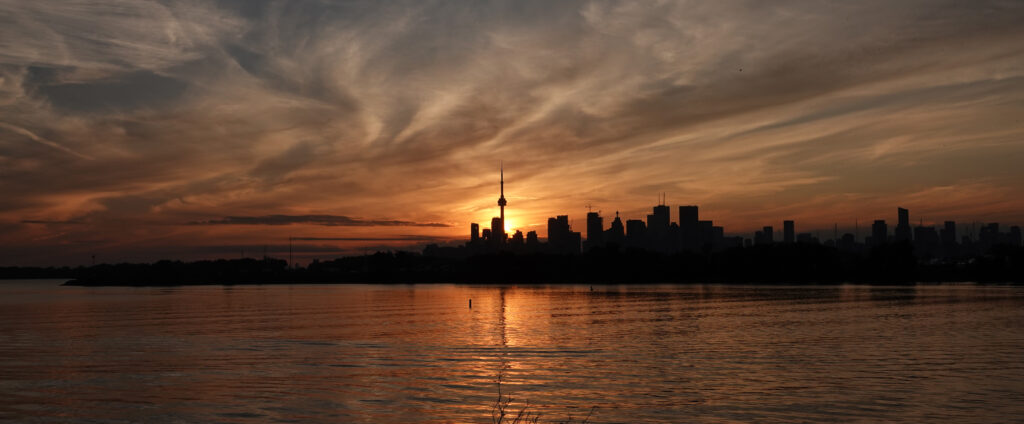 Breathtaking Twilight Skyscrapers Wallpaper Background Reflecting Calm Sea
