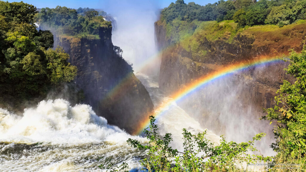 Vibrant Victoria Falls: Stunning Rainbows & Lush Greenery Wallpaper