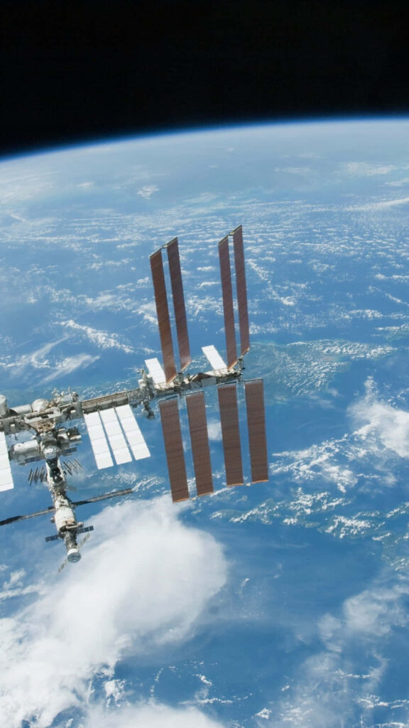 Breathtaking Space Station Wallpaper Above Earth’s Blue Atmosphere