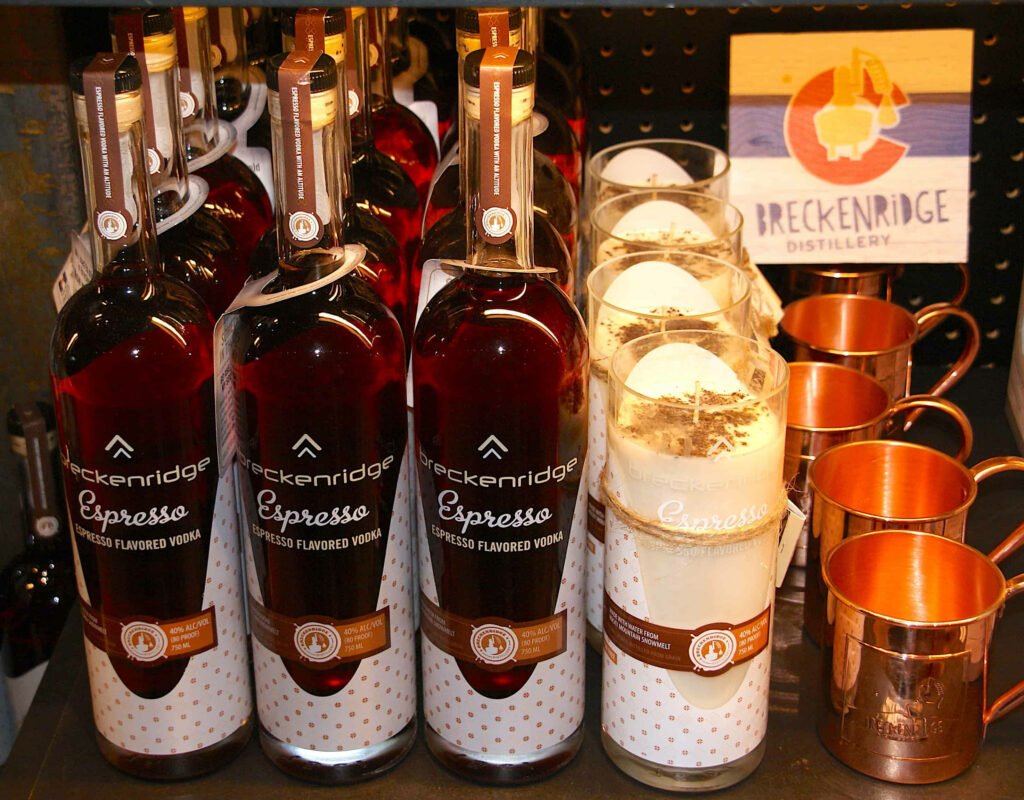 Breckenridge Distillery Espresso Vodka bottles with creamy espresso cocktails on rustic shelves Wallpaper