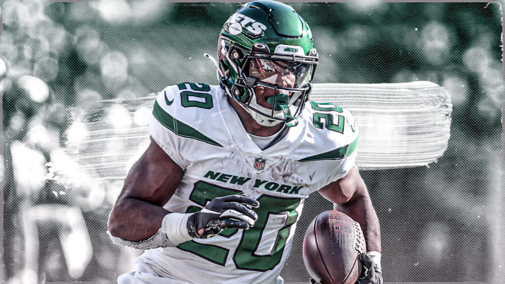 Breece Hall Jets running back charges forward in vibrant green and white football action wallpaper