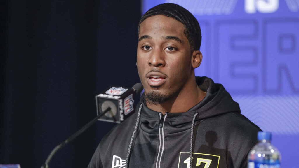 Breece Hall NFL press conference high resolution sportswear black white football wallpaper background