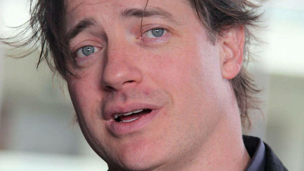 Brendan Fraser close-up portrait with gentle expression soft lighting and subtle warm tones wallpaper